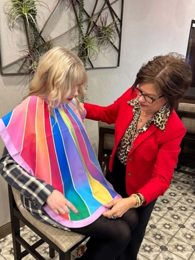 Royanna Stratmoen performing a color analysis services draping session with a client in person