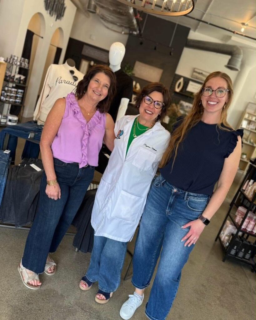 Royanna Stratmoen of Radiate with Royanna with boutique owner Karol Haas and a team member at a color analysis pop-up event at Meraki Threads & Design