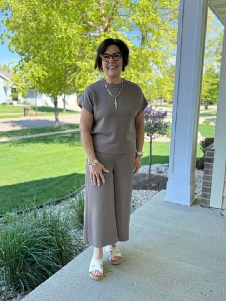 Woman over 40 getting dressed intentionally at home, feeling fabulous daily in her best colors